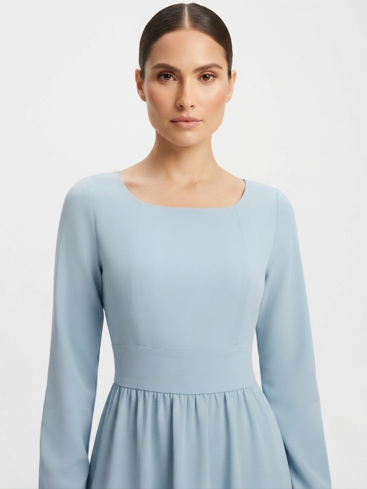 VESTIDO MANGA LARGA CON CUELLO OJAL Y LAZO GIANI CEMENTO