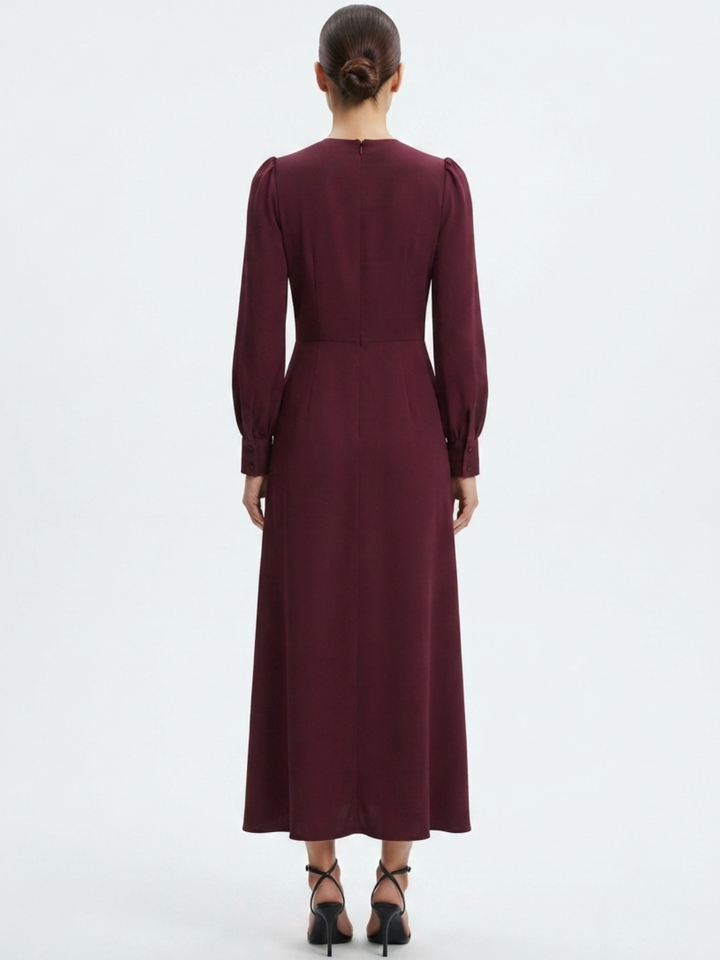 VESTIDO MANGA LARGA CON CUELLO CRUZADO Y CORTE A BARBARA VINO